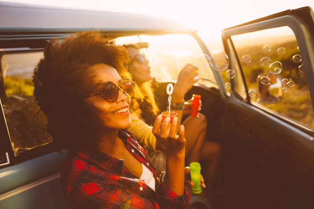 istock Friends blowing bubbles on roadtrip 486647553