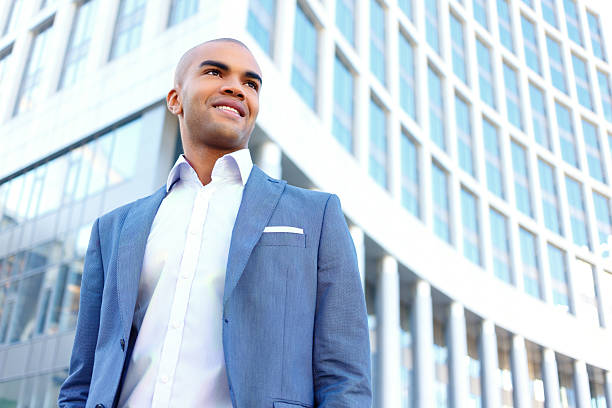 istock Pleasant businessman standing near office 486648318