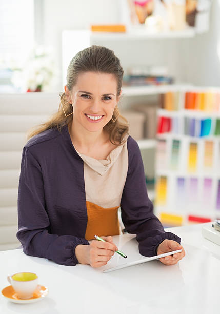 istock fashion designer working on tablet pc in office 486648443