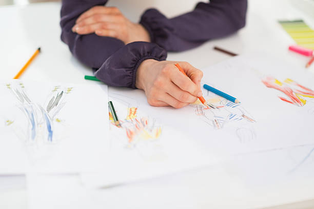 istock closeup on fashion designer making sketches 486648893