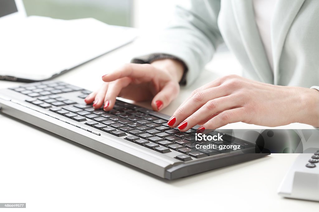 Businesswoman analyzing data Busineswoman's hands touching computer keyboard and analyzing data. Small business. Accountancy Stock Photo