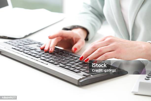 Businesswoman Analyzing Data Stock Photo - Download Image Now - Accountancy, Adult, Analyzing