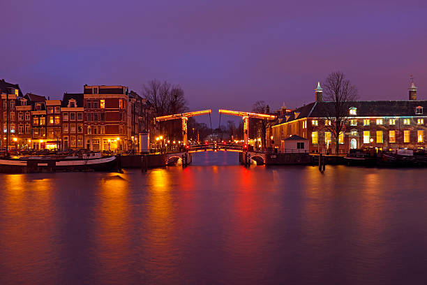 istock City scenic from Amsterdam at the Amstel by night Netherlands 486649619