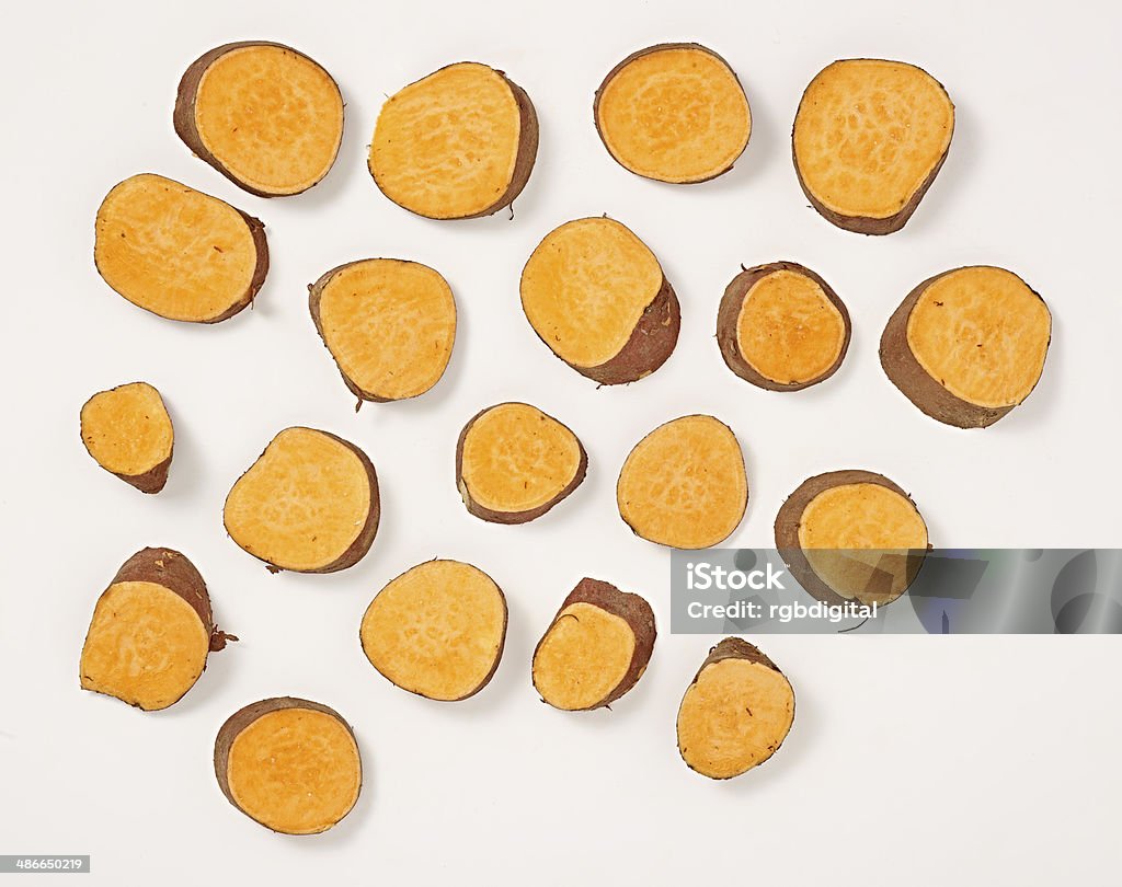 Swet Potatoe Slices of sweet potatoe on a white background with shadows Chopping Food Stock Photo