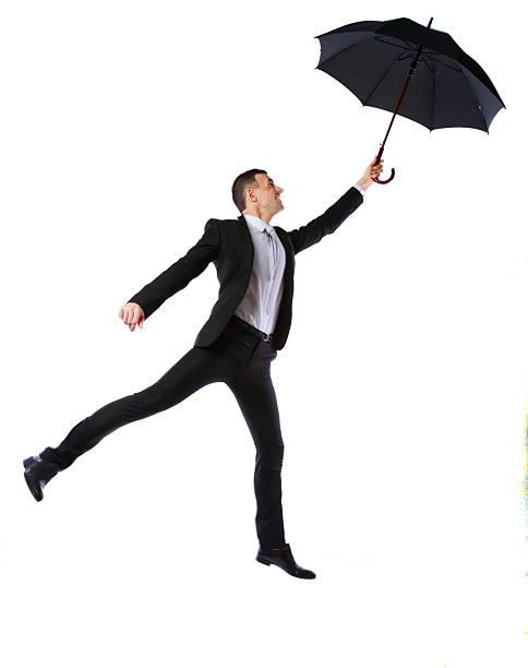 istock Businessman having fun with umbrella 486651079