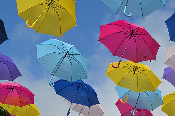 istock Colorful umbrellas in sky 486651524