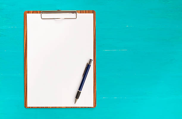 istock Wooden clipboard on blue background 486653844