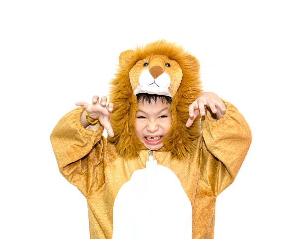 boy in lion costume stock photo