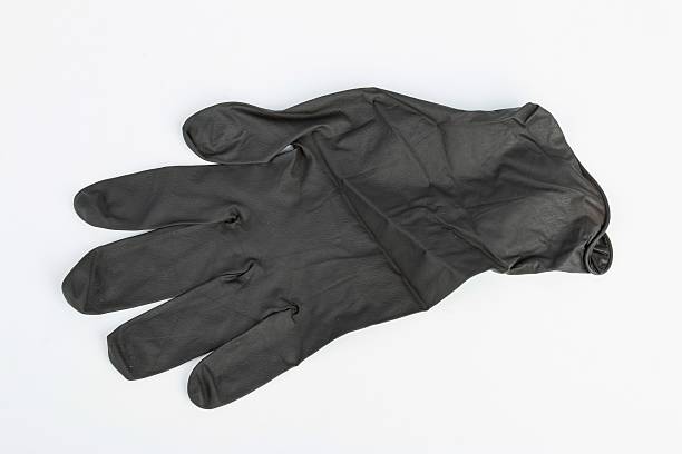 istock Black Surgical Latex Glove. 486655048