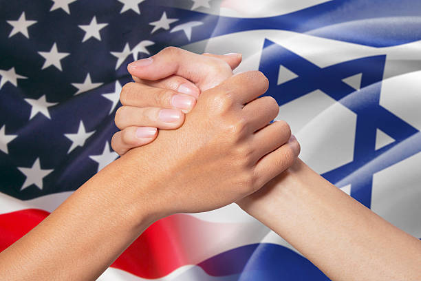 istock Partnership hand with american and israel flags 486655858