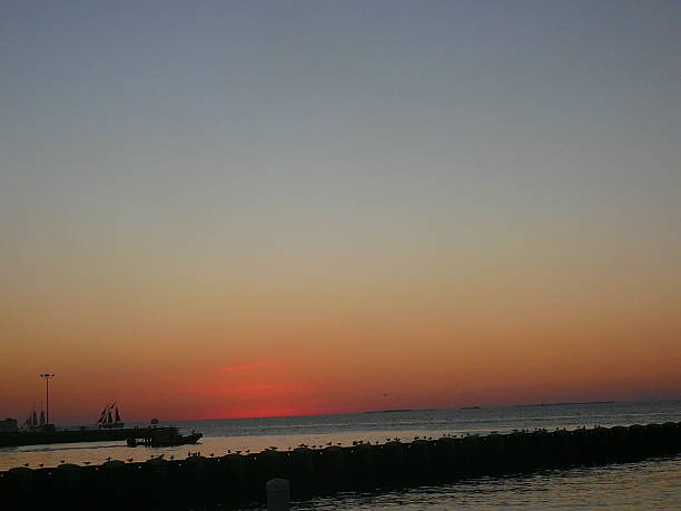 istock Sunset At Key West With Sailing Boat 486656538