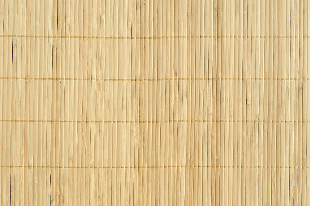 Bamboo brown straw mat as abstract texture background compositio stock photo