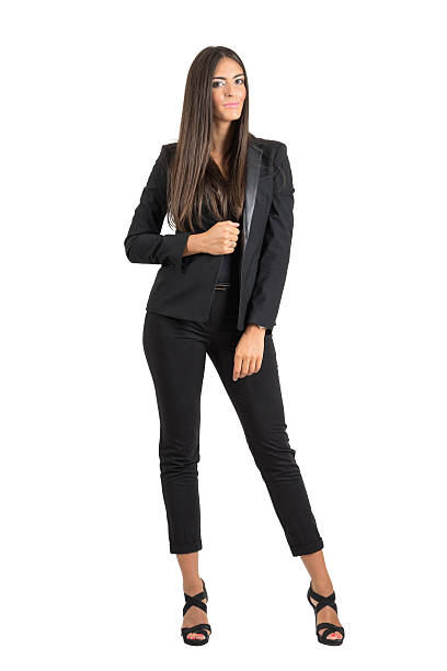 Pretty young business woman posing and smiling looking at camera stock photo