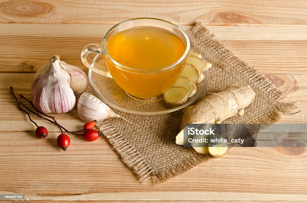 Cup of tea, ginger, garlic. Home antimicrobial therapy Garlic Stock Photo