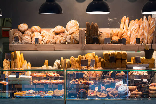 Modern bakery with assortment of bread Modern bakery with assortment of bread, cakes and buns granary photos stock pictures, royalty-free photos & images