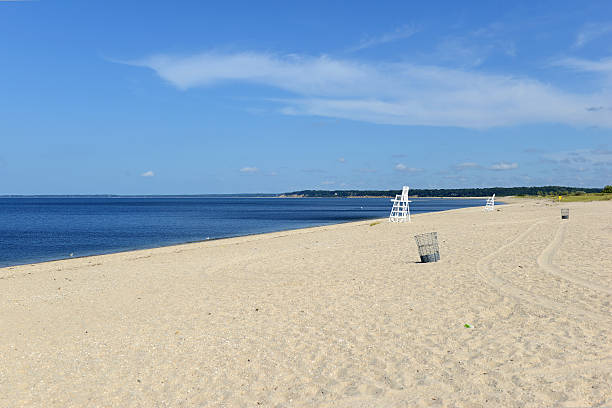 White lifeguard chair on empty sand beach with blue sky White lifeguard chair on empty sand beach with blue sky ocean beach papua new guinea stock pictures, royalty-free photos & images