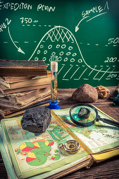 istock Examination of samples coal and marking them on the map 486664008