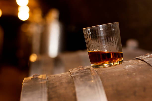 istock Glass of whiskey in distillery 486664100
