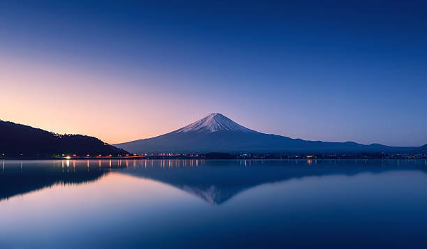 istock mountain Fuji at dawn with peaceful lake reflection 486664128