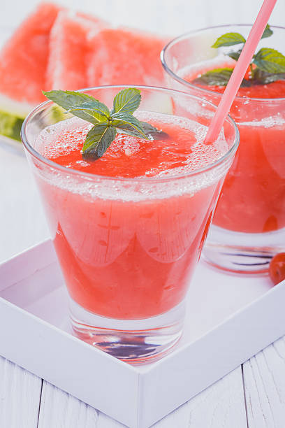 istock Watermelon smoothie on a white wooden table. 486664386