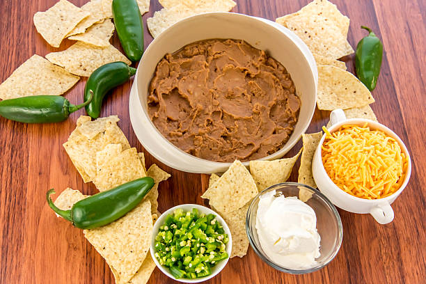istock bean dip with jalapenos, sour cream and cheddar cheese 486664960