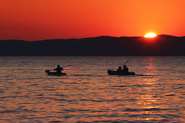 istock Sunset over the lake with boats and ducks 486665878