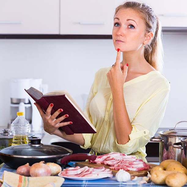 istock Housewife cooking with meat 486666666