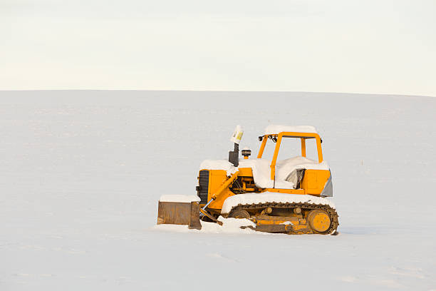 istock Bulldozer in Snowy Field 486666897