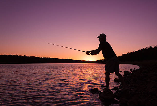 Fishing at Sunset stock photo