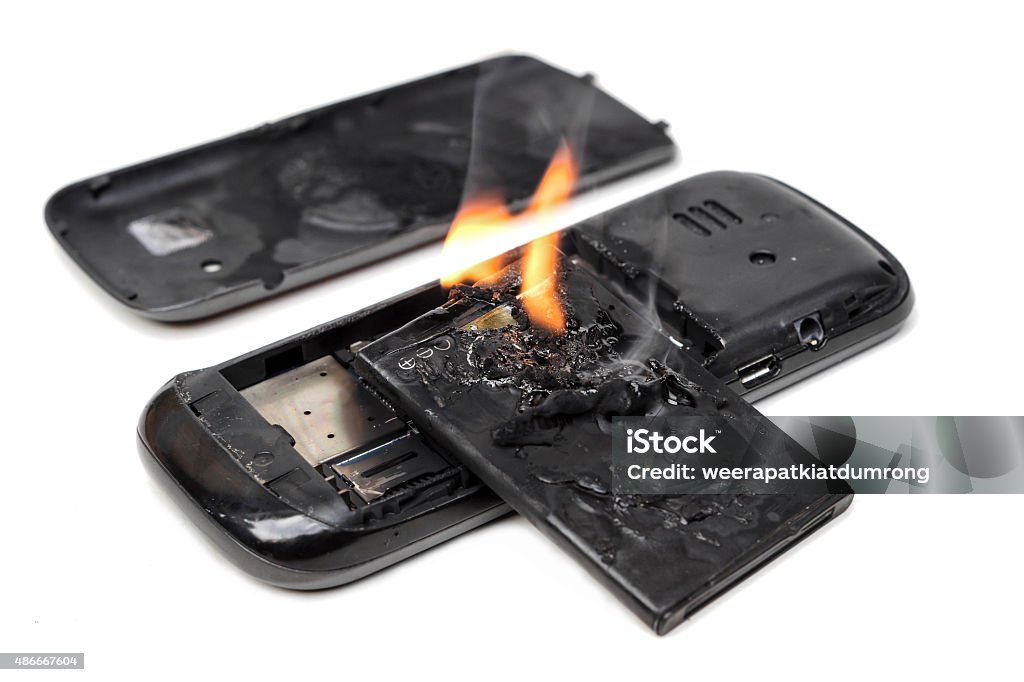 Batterie explose téléphone mobile - Photo de Pile électrique libre de droits