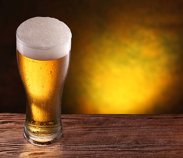 istock Beer glass on a wooden table. 486668591
