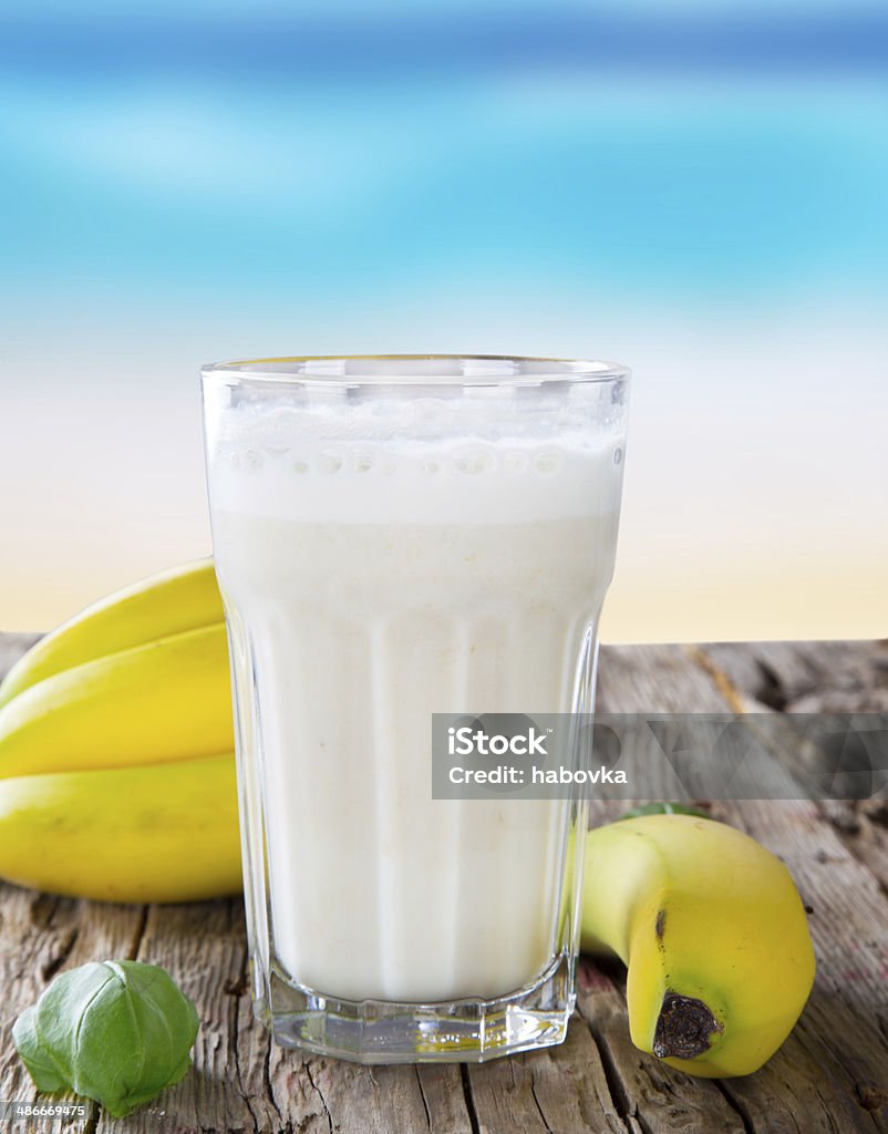 Fresh fruits milk shake on wood Fresh milk, banana drinks on wodeen table, assorted protein cocktails with fruits. Antioxidant Stock Photo