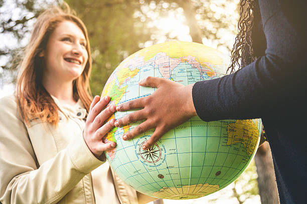 istock Two teenagers holding an earth globe 486670449