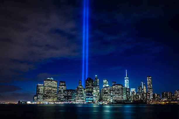 Tribute in Light September 11th "Tribute in Light" beacons shine up from lower Manhattan. New York City, NY/USA. September, 2015. 2015 stock pictures, royalty-free photos & images