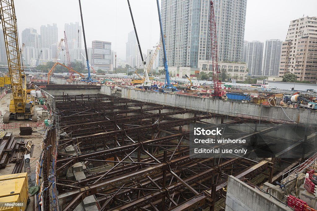 High speed rail link project delayed in Hong Kong Hong Kong, Hong Kong SAR - April 23, 2014: Construction workers at the West Kowloon Terminus of the Guangzhou-Shenzhen-Hong Kong Express Rail Link construction site in Hong Kong. Express Rail Link between Hong Kong and Guangzhou will be delayed for a year. The opening will be pushed back to 2017. Asia Stock Photo