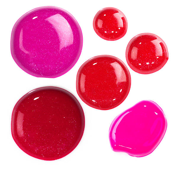 Shiny Dots of Lip Gloss isolated on white