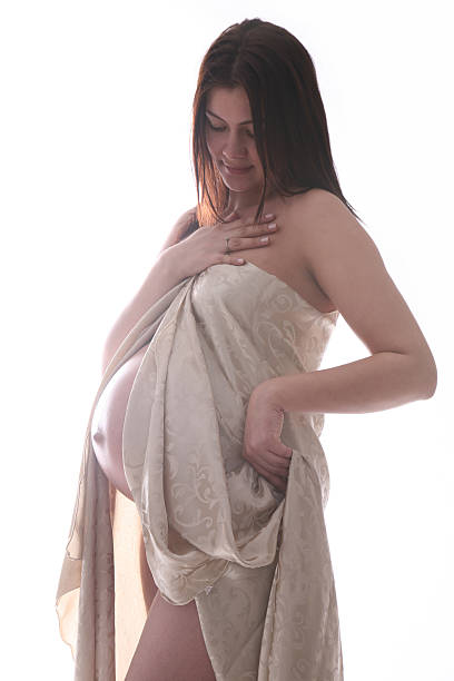 istock Beautiful pregnant woman in textile 486671125