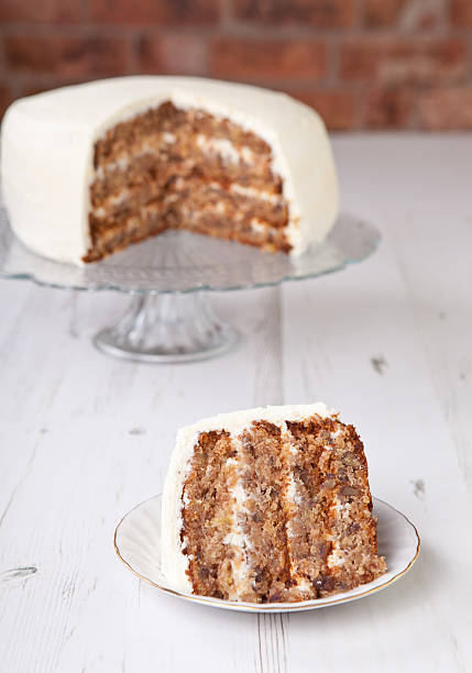 istock Piece of pecan cake with buttercream icing 486673227