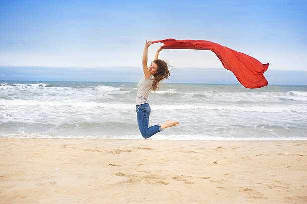 istock Sport woman jumping at the beach. 486674247
