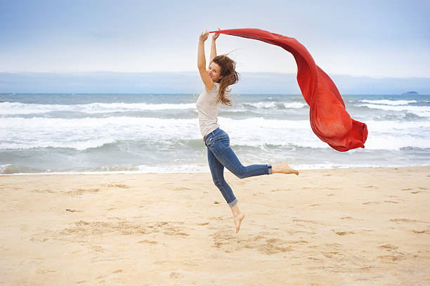 istock Sport woman jumping at the beach. 486674251