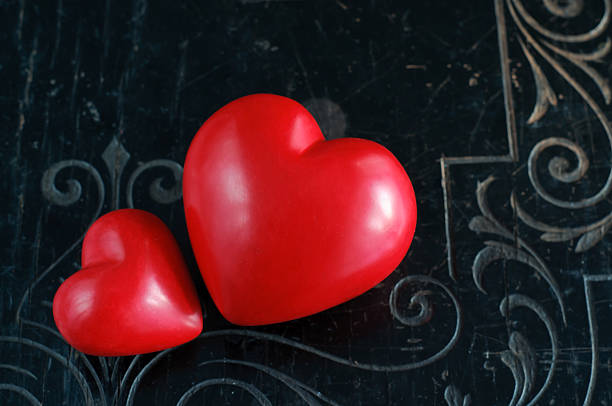 istock Two Hearts on Black Vintage Background 486674498
