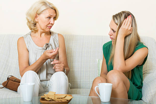 istock mature woman and  daughter  talking 486677784