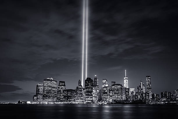Tribute in Light 2015 (B&W) September 11th "Tribute in Light" beacons shine up from lower Manhattan. New York City, NY/USA. September, 2015. memorial event photos stock pictures, royalty-free photos & images