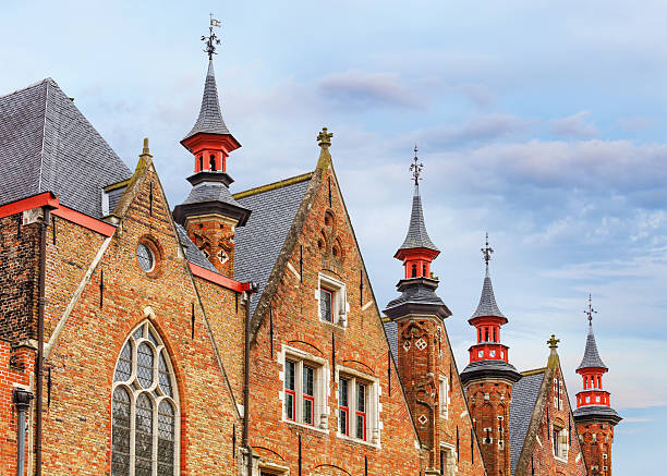 istock Bruges historical pitched roofs and spiers 486678906