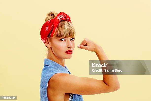 Strong Blond Woman Flexing Muscle Stock Photo - Download Image Now - Girl Power, Strength, One Woman Only