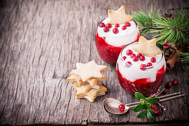 istock Festive dessert with cranberry sauce, sour cream and ginger biscuits 486680286