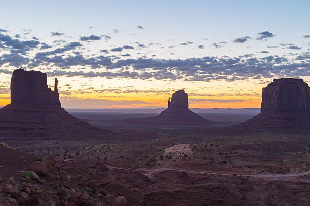 The Mittens at dawn East and West Mitten Buttes and Merrick Butte at dawn in Monument Valley. david merrick photos stock pictures, royalty-free photos & images