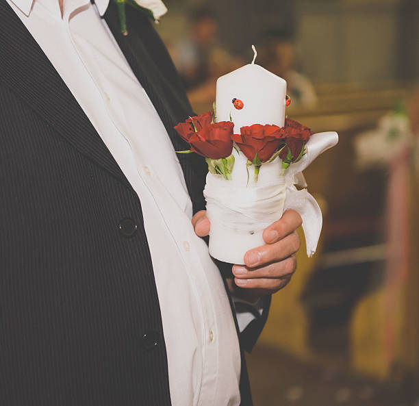 Man holding a decorated candle stock photo