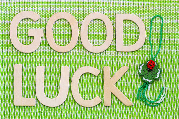 istock Good luck written with wooden letters and four-leaf clover 486681930
