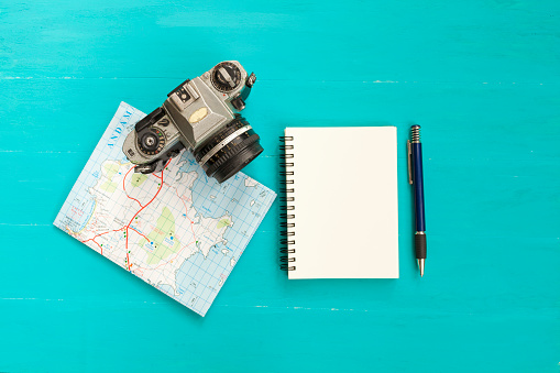 Camera and map with blank notebook, Travel plan concept